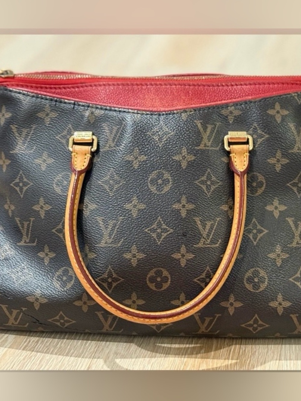 Louis Vuitton monogram vintage Pallas
MM bag with red trim